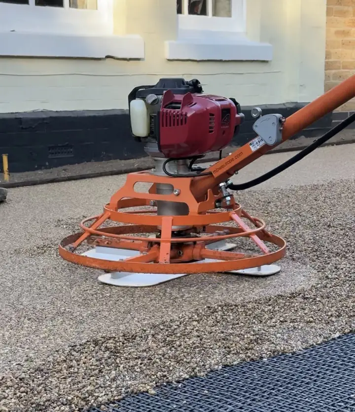 Power float smoothing a resin bound base on a T&A Resin driveway