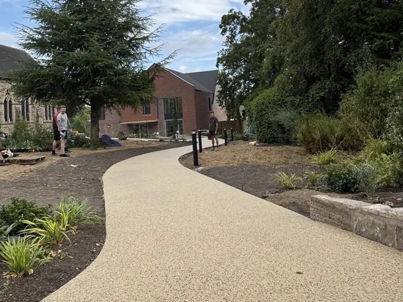 Sweeping resin bound footpath through new landscaping